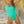 Load image into Gallery viewer, Woman on a beach at sunset wearing a Bambina Swim bright green one piece swimsuit
