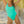 Load image into Gallery viewer, Woman on beach at sunset wearing a green one-piece swimsuit