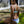 Load image into Gallery viewer, Woman wearing a Bambina Swim  two piece bikini with navy and white chevron stipe and aqua color blocks, adjustable straps
