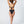 Load image into Gallery viewer, Back view of woman holding up hair wearing a black bikini. Tie back top, adjustable straps, mid coverage bottom, high cut leg bottom.
