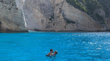 Man and woman in deep blue water in Zakynthos Greece