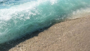 Rolling surf on sand