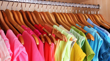 Colorful Clothing on hangers in closet