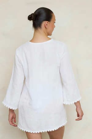 Ava Kimono in White, back view on model showing relaxed fit, and tassel trim detail.