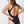 Load image into Gallery viewer, Side view of a woman wearing a black one piece swimsuit
