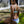 Woman wearing a Bambina Swim  two piece bikini with navy and white chevron stipe and aqua color blocks, adjustable straps