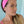Woman wearing pink headband with knot on top.