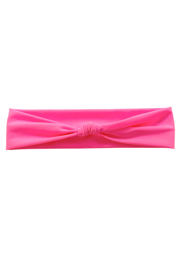 Pink headband with knot on top.