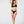 Load image into Gallery viewer, Woman in a black black bikini. Ring detail on strap, mid coverage bottom, high cut leg.
