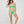 Load image into Gallery viewer, Woman standing wearing a green two piece swimsuit. Ring detail on strap, mid coverage bottom, high cut leg.
